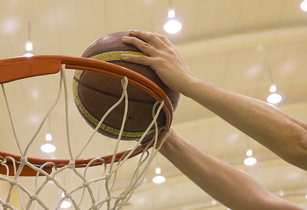 istock scoring basket in basketball court 185562509