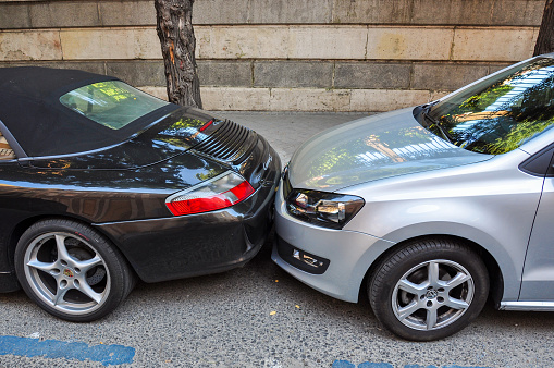 Madrid, Spain - 23 June 2018: Tight parking on narrow european streets
