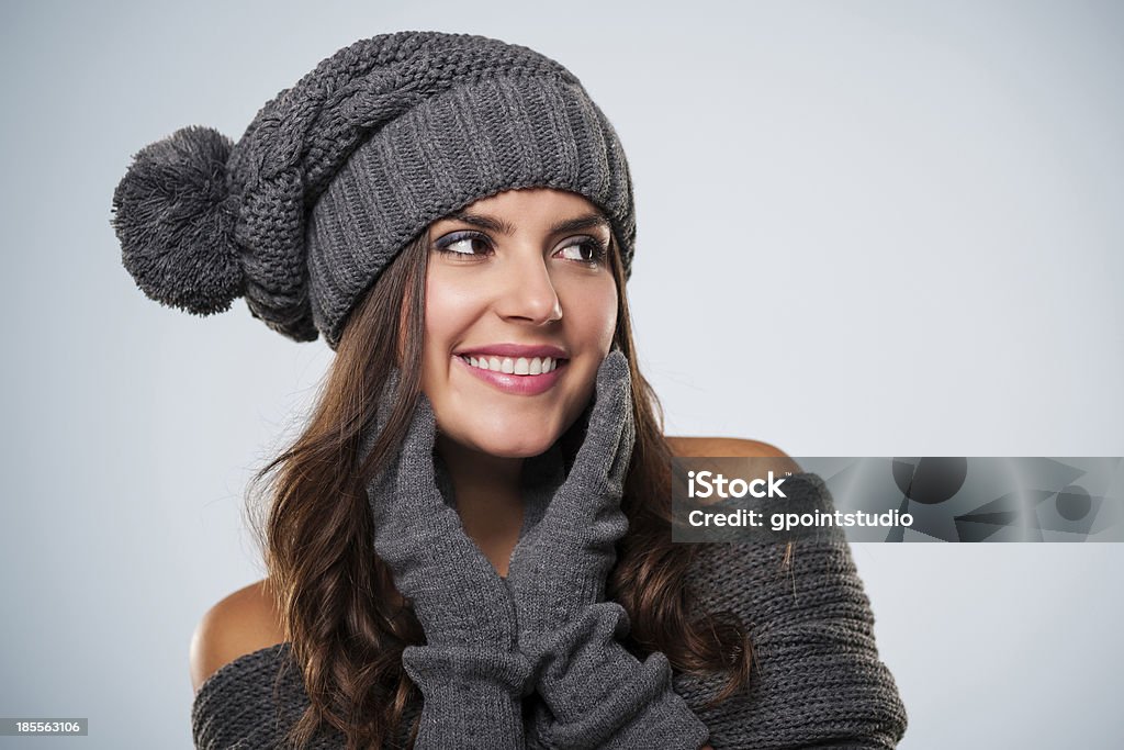 Gorgeous young woman wearing winter clothes looking at copy space Adult Stock Photo