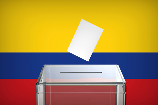 Inserting vote into the ballot box, concept image for election in Colombia