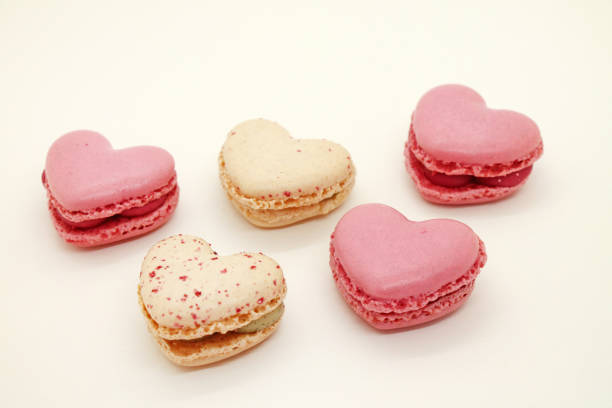 istock Group of heart shaped macaroons on white background. 1855649070