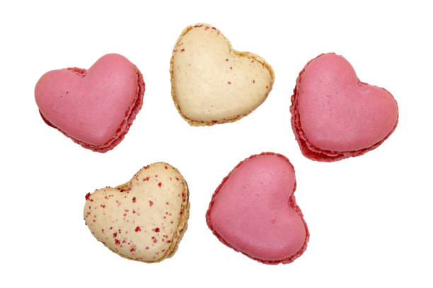 istock Group of heart shaped macaroons isolated on white. 1855649580