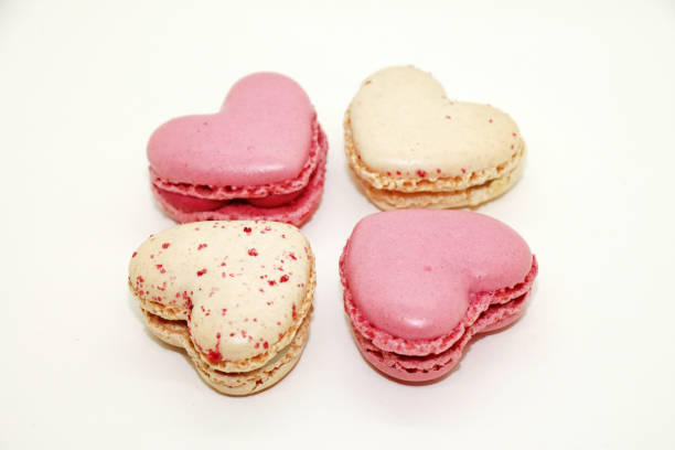 istock Group of heart shaped macaroons on white background. 1855649583