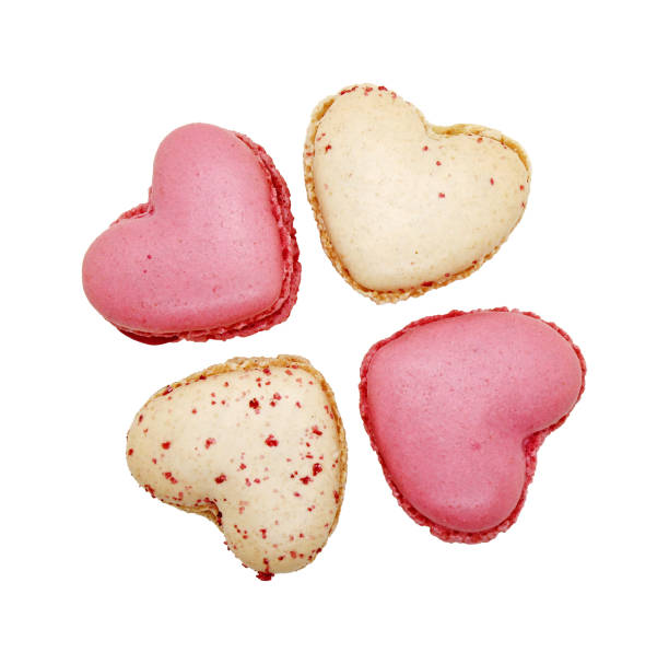 istock Group of heart shaped macaroons isolated on white. 1855649591
