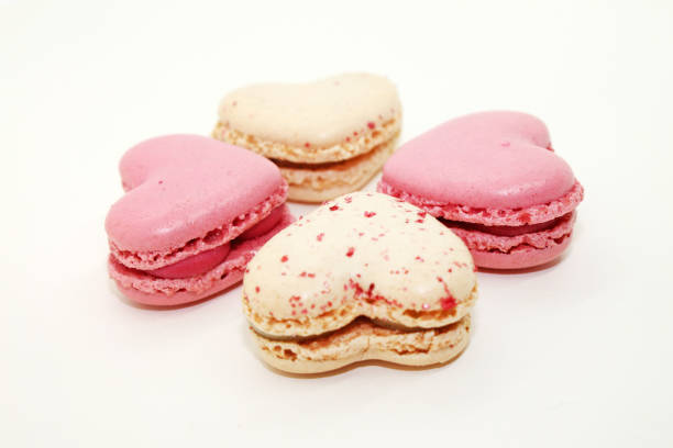 istock Group of heart shaped macaroons on white background. 1855649873