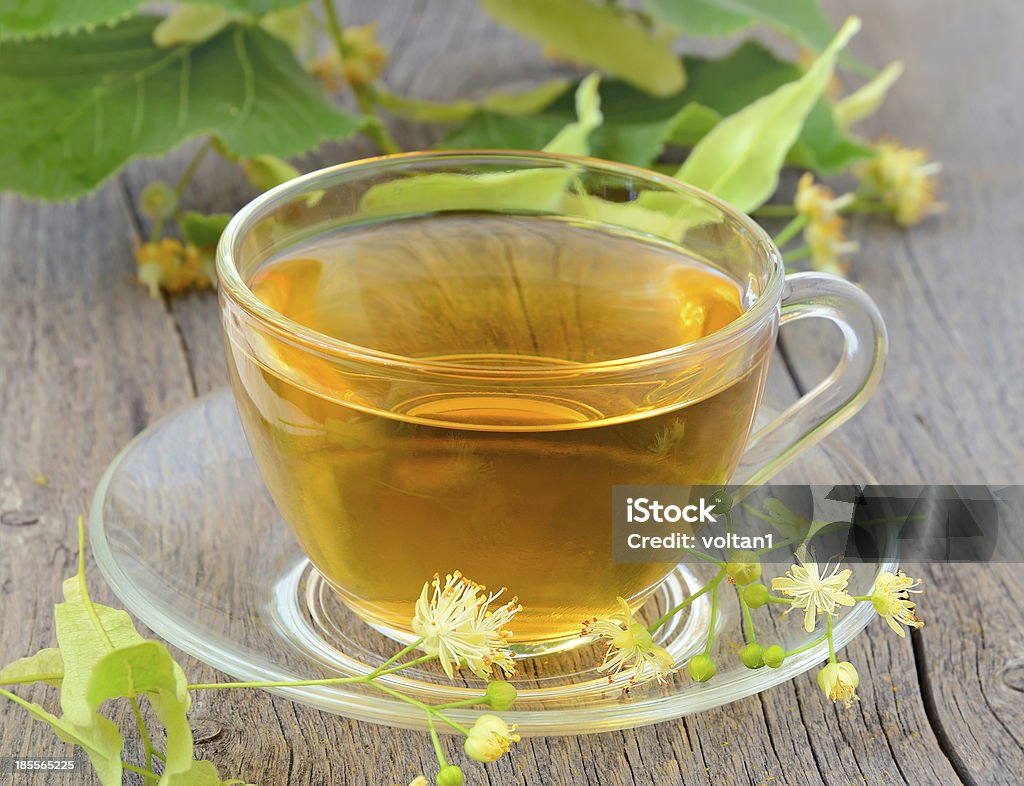 Tea with linden flowers Cup of herbal tea with linden flowers Branch - Plant Part Stock Photo