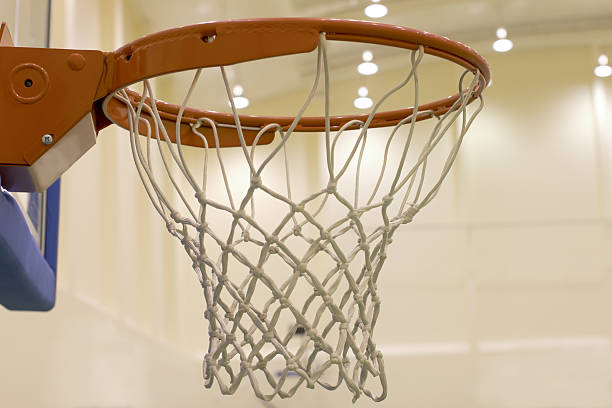 istock scoring basket in basketball court 185568720