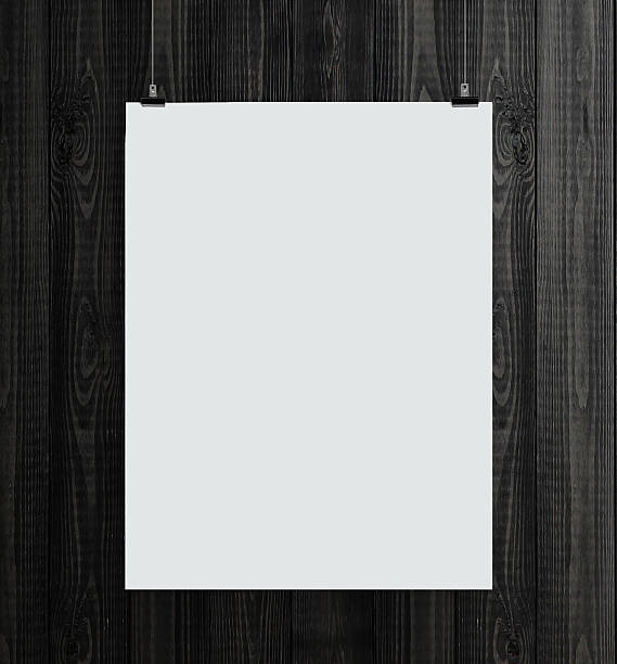 istock Blank white paper card hanging in front of a wooden backdrop 185568766