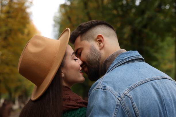 istock Happy young couple spending time together in autumn park 1855694096