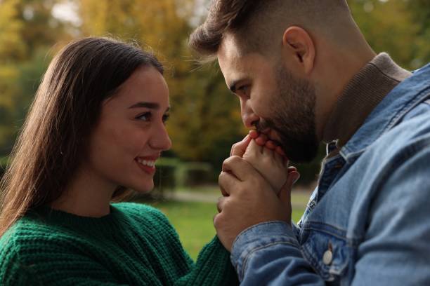 istock Happy young couple spending time together in autumn park 1855694613