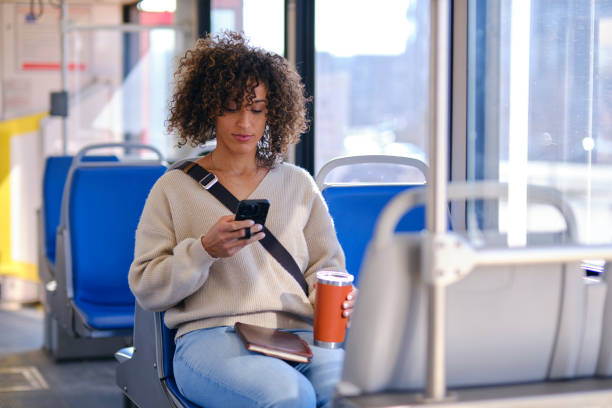 istock Woman Commuting on a Light Rail Train 1855716696