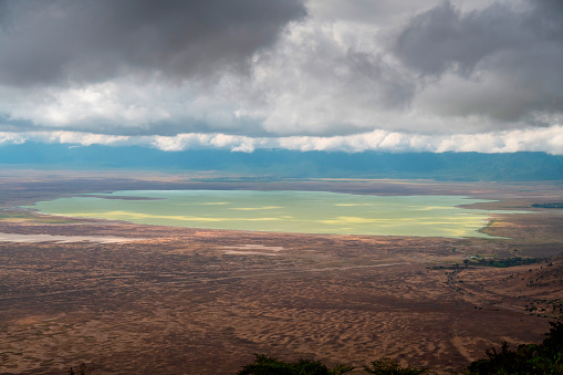 Beautiful panoramic view from above with beautiful light of ngorongoro crater overlooking alkaline lake Makati - Tanzania