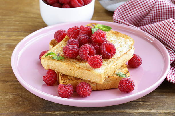 fresh toasted toast with raspberries and powdered sugar