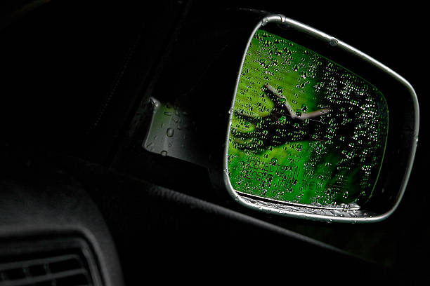 Spooky Hand of someone or something in a car mirror at night