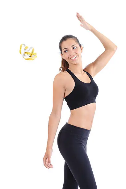 Photo of Fitness woman throwing a tape measure