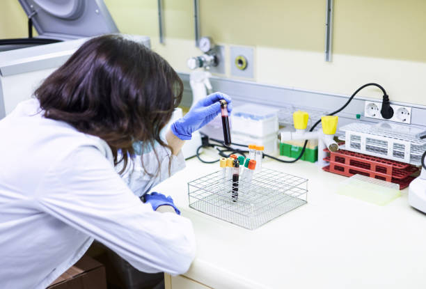 istock Scientist holding a tube containing a blood sample ready for analysis in the laboratory 1855752215