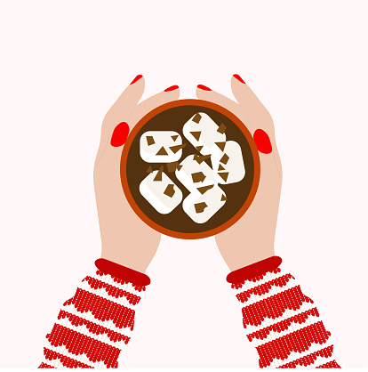 Female hand holding hot chocolate xmas mug