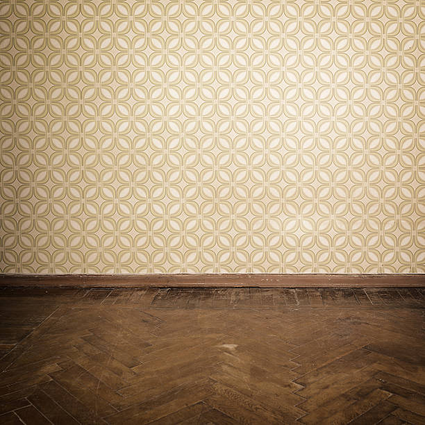 Vintage room, empty retro apartment with old fashioned wallpaper and weathered wooden parquet floor, toned