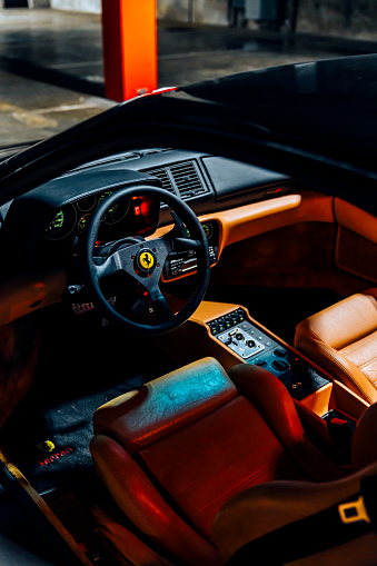 Seattle, WA, USA\n12/14/2023\nBlack Ferrari F355 parked showing the steering wheel