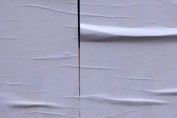 istock Blank white crumpled and creased paper poster texture background 1855836716