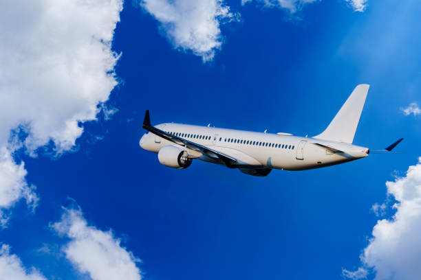 istock Passengers Commercial airplane flying above dramatic clouds. Travel concept. 1855840836
