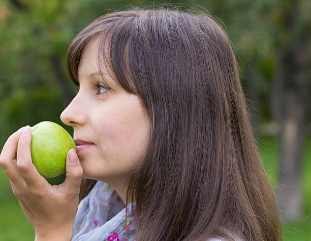 istock Girl and green apples 185584731