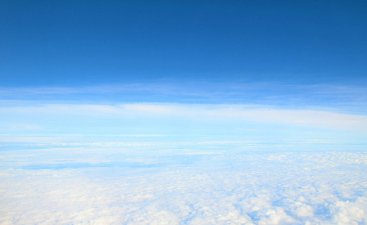 blue sky and clouds background.\nin-flight photography.