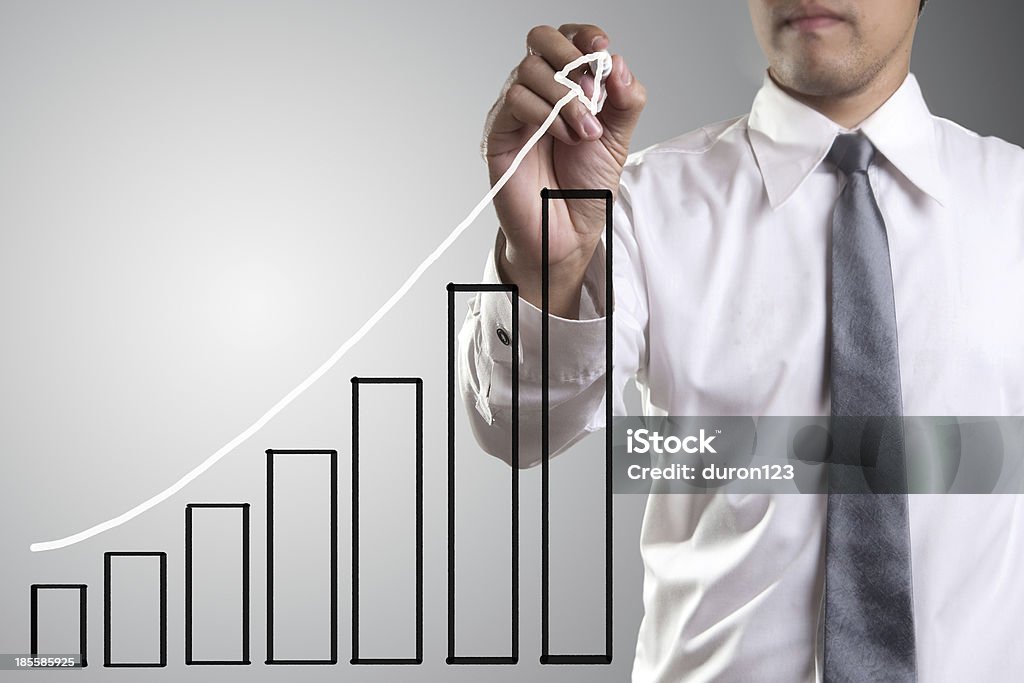 Male hand drawing a chart Male hand drawing a chart isolated on white background Achievement Stock Photo