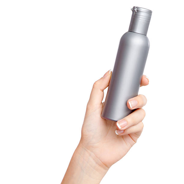 istock Female hand with a cosmetics bottle 185585934