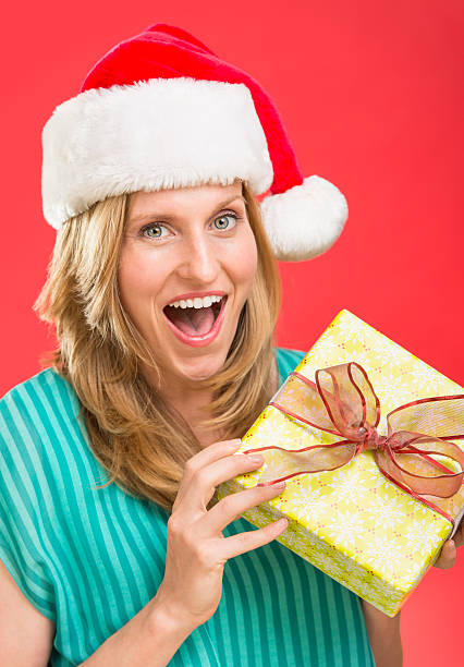 istock Surprised Woman Holding Christmas Present 185586765