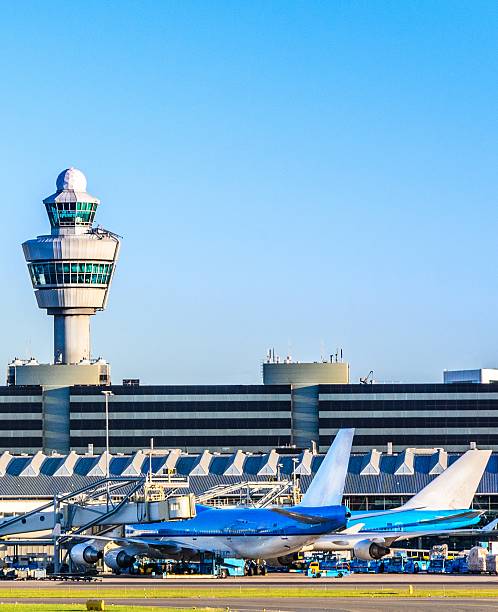 istock Planes waiting at a terminal in an airport 185586979
