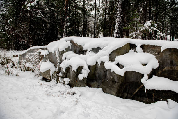 Winter. Rocks covered in snow. Snow and stone background landscape
