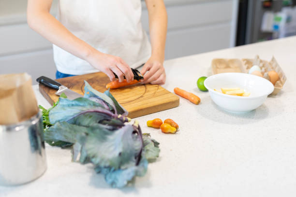 istock Young woman preparing food in the kitchen 1855898663