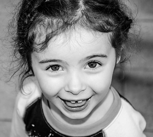 istock Cute Little Girl Laughing To Camera 185591312