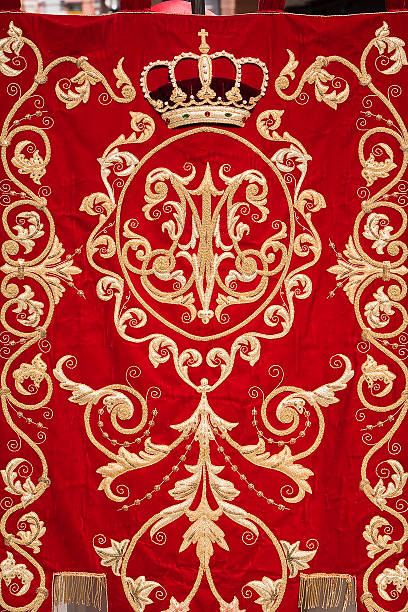 istock Embroidery thread of gold on red velvet, Spain 185592355