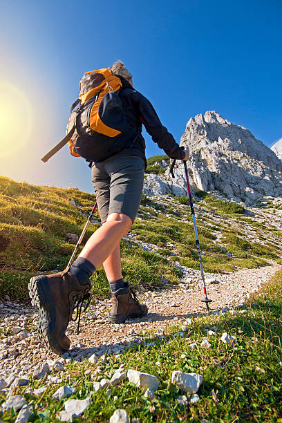 Hiking Young woman on a sunny day hiking in high mountains northern european descent stock pictures, royalty-free photos & images