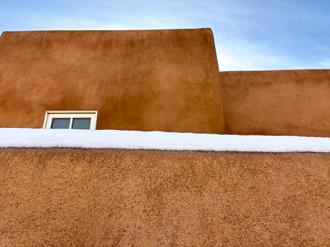 Santa Fe, NM: Adobe Walls in a snowstorm. Copy space available.