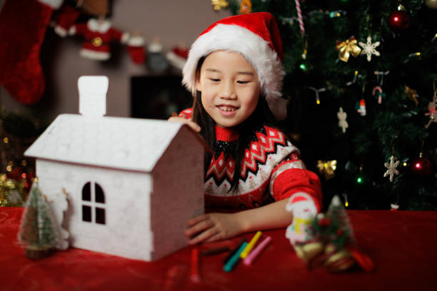 istock young girl making Christmas craft at home 1855933021