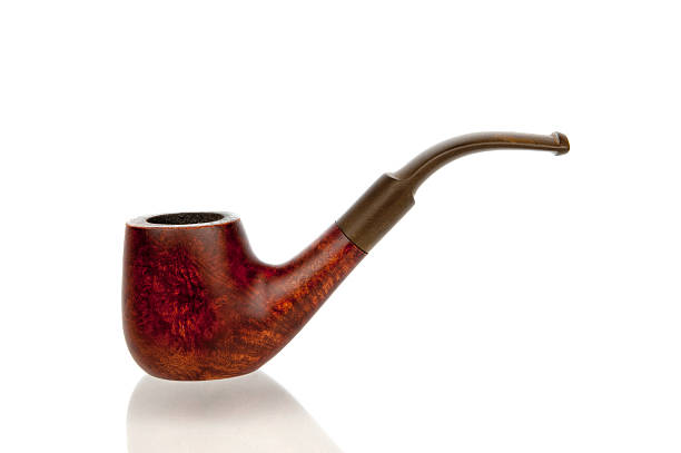 A vintage wood and metal pipe with its cover opened