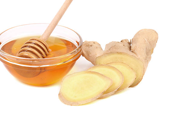 istock Root Ginger sliced and bow of honey. 185595260