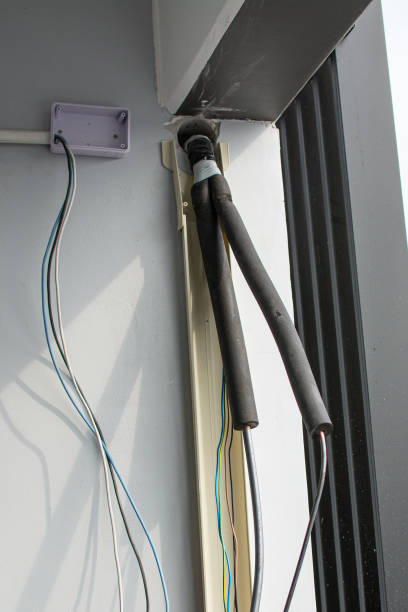 istock air conditioner hose with insulation. outdoor unit. 1855980335