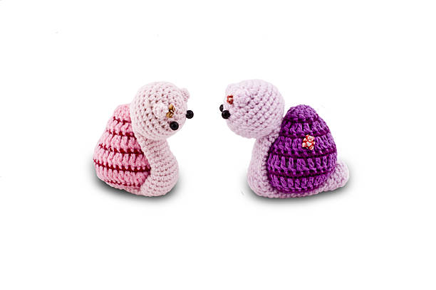 istock knitted Garden snail in front of a white background 185599058