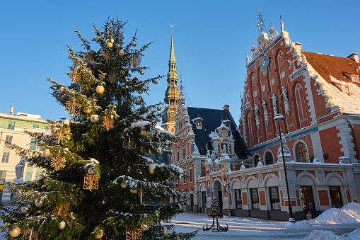 Decorated Christmas tree in the Town Hall Square in the winter. Old Riga city, Latvia.