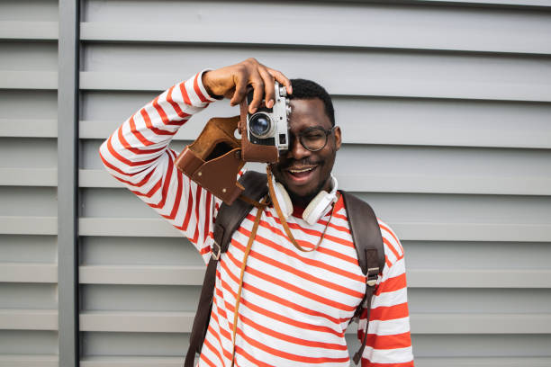 Happy young African American is traveling and enjoying his vacation