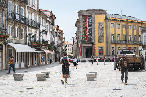 Viana do Castelo, Portugal - June 29 2023: People walking in Republic Square, view of House of Mercy and the Old Town Hall, selective focus