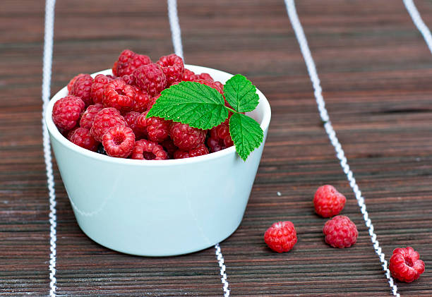 bowl with raspberries stock photo