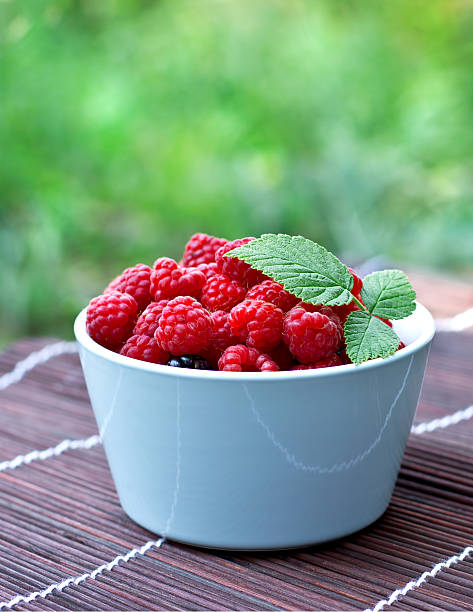 bowl with fresh raspberry stock photo