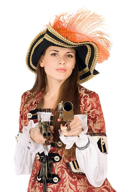 Charming young woman with guns dressed as pirates