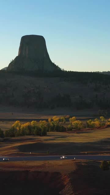 Devils Tower Butte at Sunset. Crook County Landscape, Wyoming. Aerial View. Vertical Video