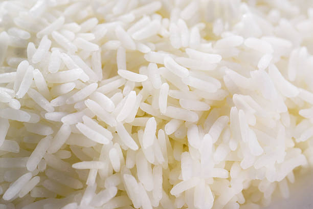 istock White long rice. food background 185609416
